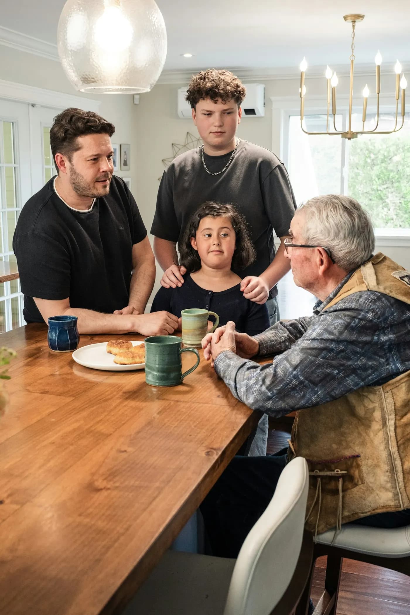 A family talking and reviewing an emergency plan at a wooden table